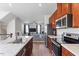 Open concept kitchen with stainless steel appliances and view into the living room at 515 Autumn Cure Ct, Fuquay Varina, NC 27526