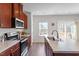Spacious kitchen with island, modern appliances, and plenty of counter space at 515 Autumn Cure Ct, Fuquay Varina, NC 27526