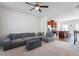 Bright, open-concept living room with a sectional sofa, dining area, and kitchen view at 515 Autumn Cure Ct, Fuquay Varina, NC 27526