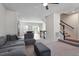 Spacious living room with an open floor plan and staircase access to the second level at 515 Autumn Cure Ct, Fuquay Varina, NC 27526