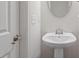 A pedestal sink powder room conveniently located for guests near the front door at 515 Autumn Cure Ct, Fuquay Varina, NC 27526