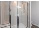 Modern bathroom shower featuring glass doors and updated tile at 515 Autumn Cure Ct, Fuquay Varina, NC 27526