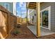 Enclosed backyard features a stone patio and fenced perimeter, providing privacy and security at 517 Coleman St, Raleigh, NC 27610