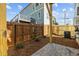 Fenced backyard featuring a patio and landscaping, offering privacy and space for outdoor enjoyment at 517 Coleman St, Raleigh, NC 27610