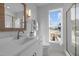 Bright bathroom with double vanity, undermount sink, and shower with glass door at 517 Coleman St, Raleigh, NC 27610