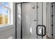 Bathroom showcasing a glass-enclosed shower with dual shower heads and sleek, modern design at 517 Coleman St, Raleigh, NC 27610