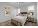 Bright bedroom with hardwood floors, ceiling fan, and lots of natural light at 517 Coleman St, Raleigh, NC 27610