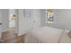 Cozy bedroom with hardwood floors and an open window with a porch view at 517 Coleman St, Raleigh, NC 27610