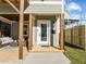 Inviting home front entrance featuring a cozy covered porch with wooden columns and a stylish front door at 517 Coleman St, Raleigh, NC 27610