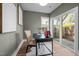 Bright home office featuring hardwood floors, neutral walls, and sliding glass door leading to outdoor patio at 517 Coleman St, Raleigh, NC 27610