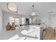 Stylish kitchen featuring a large island, stainless steel appliances, and modern lighting, perfect for cooking and gathering at 517 Coleman St, Raleigh, NC 27610