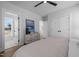 Spacious main bedroom with hardwood floors, dresser, closet, and attached bathroom at 517 Coleman St, Raleigh, NC 27610