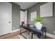 Comfortable home office features modern desk, hardwood floor, and white accents at 517 Coleman St, Raleigh, NC 27610