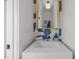 Stylish powder room featuring a modern vanity, marble countertop, and unique tiled accent wall for a touch of elegance at 517 Coleman St, Raleigh, NC 27610