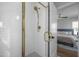 Beautiful walk-in shower features white tiling and gold fixtures at 517 Coleman St, Raleigh, NC 27610