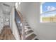 Hardwood stairway with white risers and black railing leading to the second floor at 517 Coleman St, Raleigh, NC 27610