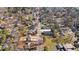 An aerial view shows the house nestled in a neighborhood with mature trees and proximity to main street at 518 W Chisholm St, Sanford, NC 27330