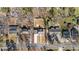 Bird's eye view reveals the property's layout, showcasing the house, driveway, and well-sized front and back yards at 518 W Chisholm St, Sanford, NC 27330