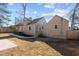 Cozy home backyard featuring a patio area and fresh landscaping at 518 W Chisholm St, Sanford, NC 27330