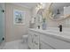 Bright bathroom offers a double vanity, white cabinets, and modern fixtures for a functional and elegant design at 518 W Chisholm St, Sanford, NC 27330