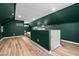 Upstairs bedroom loft with wood flooring and accent wall at 518 W Chisholm St, Sanford, NC 27330