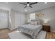 Comfortable bedroom with plush carpeting, ample natural light, and a ceiling fan at 518 W Chisholm St, Sanford, NC 27330