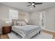 Comfortable bedroom with plush carpeting, ample natural light, and a ceiling fan at 518 W Chisholm St, Sanford, NC 27330