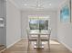 Light filled dining room featuring modern chandelier and view to the outdoor living space at 518 W Chisholm St, Sanford, NC 27330