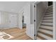 Entryway with hardwood floors and views to kitchen and stairs at 518 W Chisholm St, Sanford, NC 27330