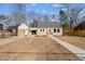 Traditional single-Gathering home with manicured front lawn, driveway, sidewalk and welcoming front door at 518 W Chisholm St, Sanford, NC 27330