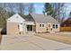Inviting single Gathering home features a spacious driveway, a charming front entrance, and a well-maintained lawn at 518 W Chisholm St, Sanford, NC 27330