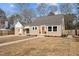 Inviting single-Gathering home featuring a well-manicured front yard and charming details at 518 W Chisholm St, Sanford, NC 27330