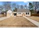 Charming single-story home with manicured lawn and inviting front porch at 518 W Chisholm St, Sanford, NC 27330