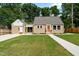 Charming single-Gathering home with a well-maintained front yard and inviting, bright colored front door at 518 W Chisholm St, Sanford, NC 27330