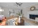 Bright living room features hardwood floors, fireplace, and neutral paint scheme at 518 W Chisholm St, Sanford, NC 27330