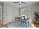 Office space featuring hardwood floors, a ceiling fan, a window, and modern decor at 518 W Chisholm St, Sanford, NC 27330