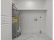Utility room with tile floor, water heater and utility hookups at 518 W Chisholm St, Sanford, NC 27330
