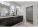 Bathroom with double vanity, granite countertop, and a walk-in closet at 5212 Huntley Overlook Dr, Durham, NC 27703