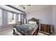 Bedroom with dark wood furniture, tray ceiling, and light purple paint at 5212 Huntley Overlook Dr, Durham, NC 27703