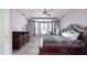 Bedroom with dark wood furniture, tray ceiling, and light purple paint at 5212 Huntley Overlook Dr, Durham, NC 27703