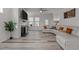 Open-concept living room featuring a fireplace, ceiling fan, and modern flooring at 5212 Huntley Overlook Dr, Durham, NC 27703