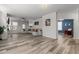 Spacious living room with modern flooring, fan, recessed lighting, and comfortable furniture at 5212 Huntley Overlook Dr, Durham, NC 27703