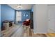 Office space with bright blue walls, modern flooring, and natural light at 5212 Huntley Overlook Dr, Durham, NC 27703