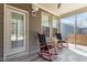 Charming screened porch featuring cozy seating, providing an ideal spot for outdoor relaxation and entertainment at 5212 Huntley Overlook Dr, Durham, NC 27703