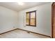 Cozy bedroom featuring neutral carpet, a window, and a built-in closet for ample storage at 5315 Cole Mill Rd, Durham, NC 27705