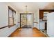 Bright dining room with a chandelier, natural light and access to the deck from the sliding glass door at 5315 Cole Mill Rd, Durham, NC 27705