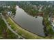 A picturesque aerial view of the lake and surrounding community at 58 Lake Village Drive Dr, Durham, NC 27713