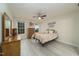 Comfortable bedroom with ceiling fan and natural light from the windows at 58 Lake Village Drive Dr, Durham, NC 27713