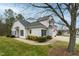 Exterior shot shows landscaping, walkway, lawn, and manicured yard at 58 Lake Village Drive Dr, Durham, NC 27713