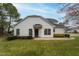 Exterior elevation of house, highlighting its attractive landscaping and well-manicured lawn at 58 Lake Village Drive Dr, Durham, NC 27713